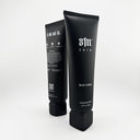 S1N Care vitamin-rich body lotion tubes with organic ingredients perfect for tattoos, featuring sleek black packaging with white logo, 200ml